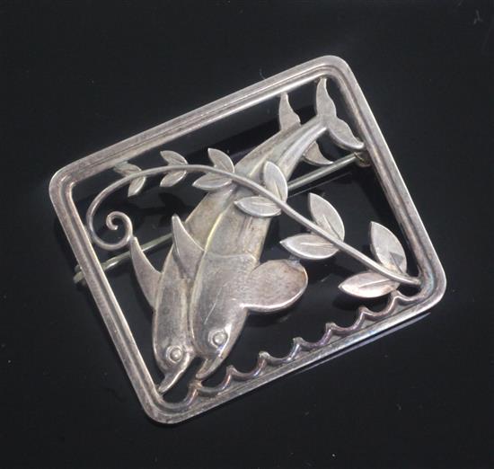 A Georg Jensen Danish sterling silver dolphin brooch no.251, designed by Arno Malinowski, 1.5in.